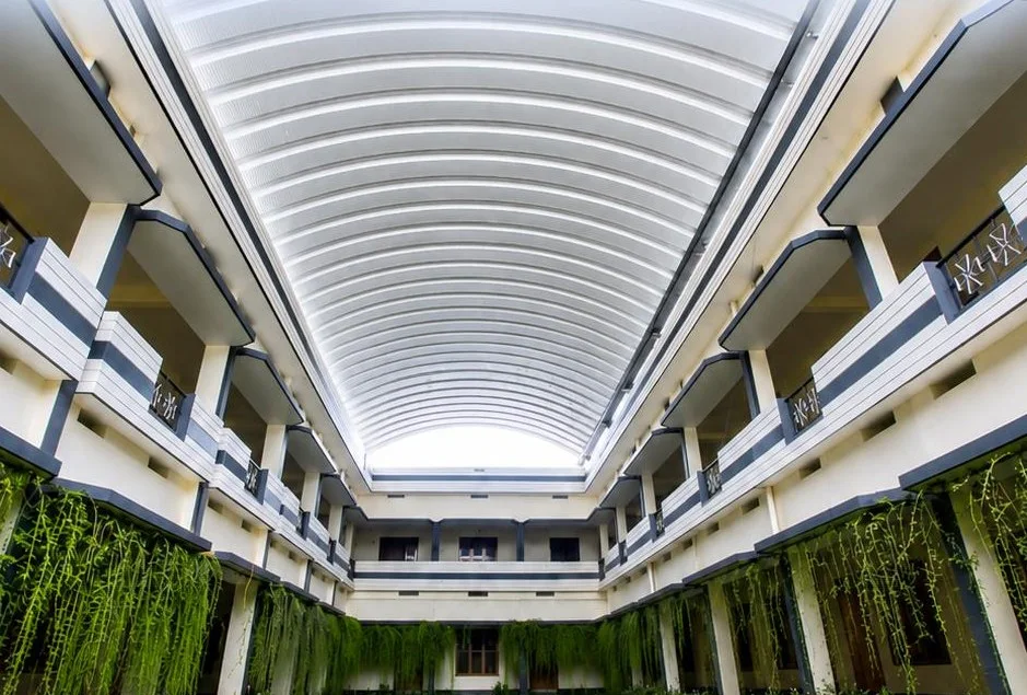 Truss-less arch roof over a building courtyard by iRoofing